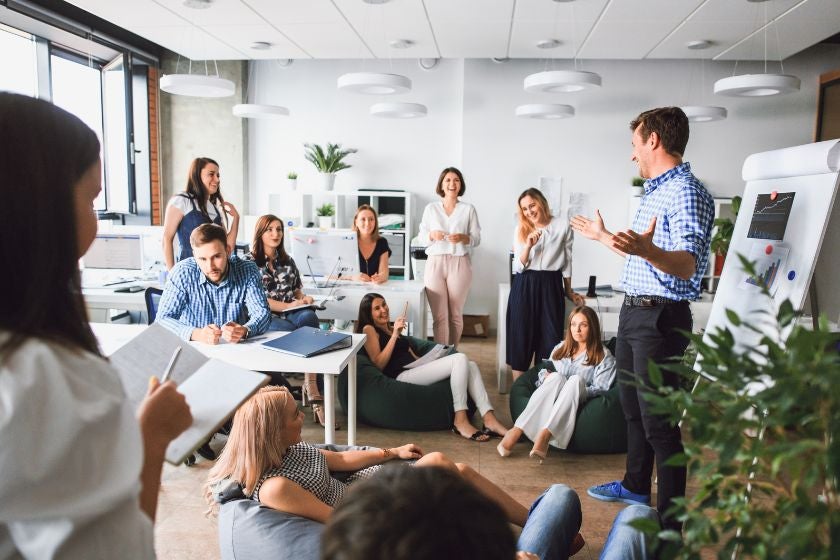 Group in conference room listening to someone